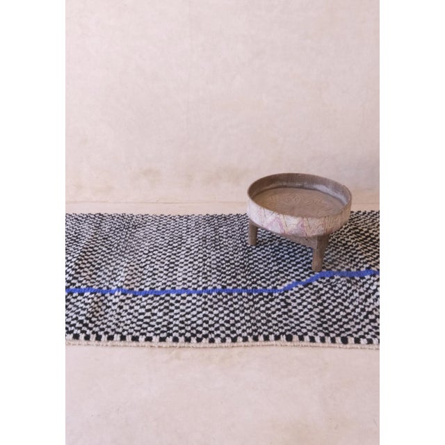 This Moroccan Checkered Wool Rug is crafted from natural fibers, providing an eco-friendly and sustainable option for your...