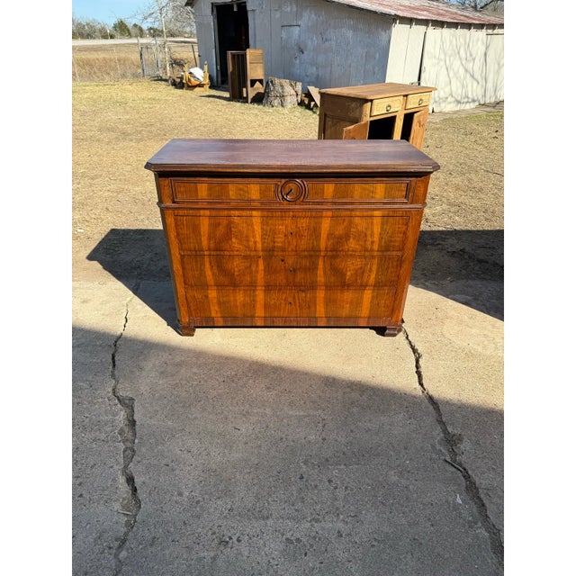 19th Century French Louis Philippe Commode. Made of walnut, the wood has been finished with a lustrous French polish, it...