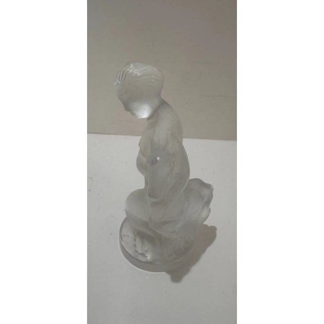 Beautiful vintage Lalique frosted crystal figure of a kneeling woman cradling a lamb. Marked Lalique France on base. In...