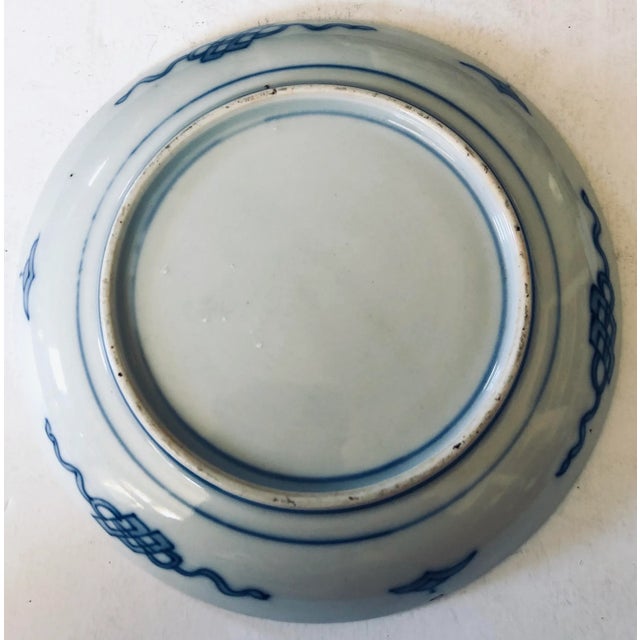 Beautifully hand painted Imari plate with raised edge has a blue cloud motif as it's central pattern surrounded by...