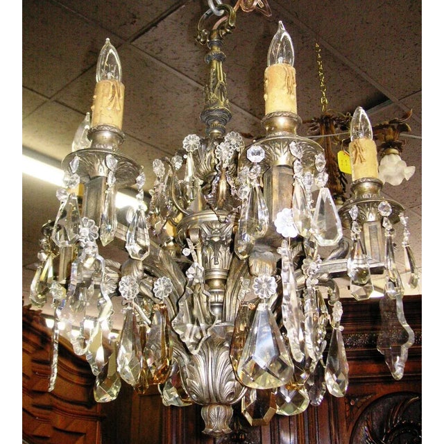 Bold and beautiful, a 19c French nickle on bronze Louis XVI style chandelier with 6 Edison based bulbs and a plethora of...