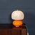 A striking Murano glass mushroom table lamp produced in Italy during the 1970s, embodying the playful organic forms and...