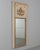 An early 20th century French Louis XVI style trumeau mirror with painted pine frame and gilded trim. Carved giltwood...