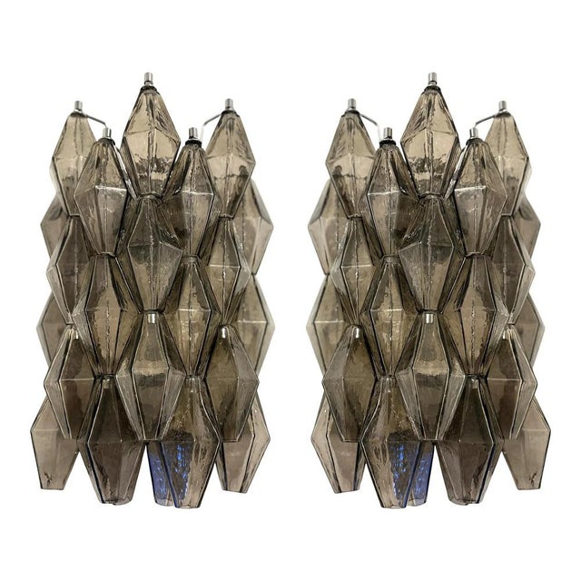 Contemporary and luxury wall sconces with fumè “poliedri” murano glass in venini style. glass elements are blown inside a...