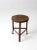 This is a vintage industrial stool. The three legged stool has a round wooden seat, and aged red barn paint colors the...