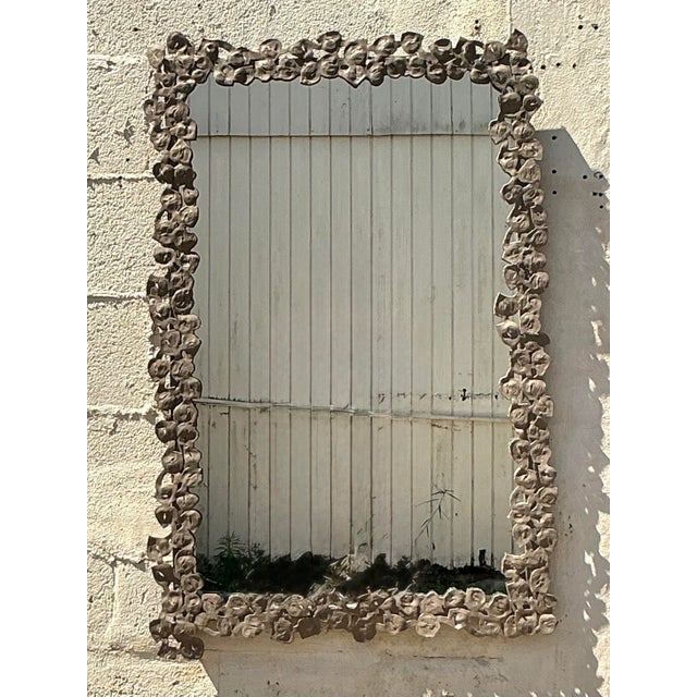 Bring a touch of artistic craftsmanship to your interiors with this Vintage Boho Hammered Metal Floral Ring Mirror....