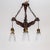 A dark walnut-stained wood chandelier in a 4-arm structure of basic, stylized, hand-carved birds that come together at the...