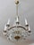 A luxurious crystal chandelier in a classic pear shape with eight elegantly curved arms and five inner lights. This richly...