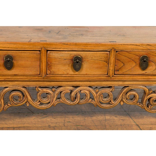 Chinese Qing Dynasty 19th Century Low Kang Cabinet with Carved Scrolling Apron For Sale - Image 10 of 13