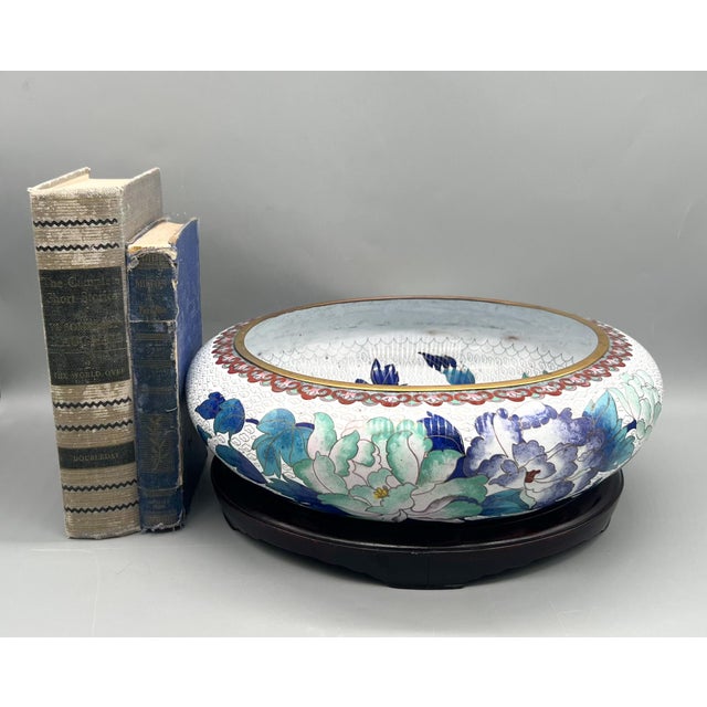Striking large cloisonné bowl featuring a lush peony and foliage motif in rich shades of cobalt, teal, and soft celadon...