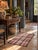 A set of three vintage woven rag rugs featuring a softly faded plaid pattern in dusty rose, cream, tan, and navy. The...