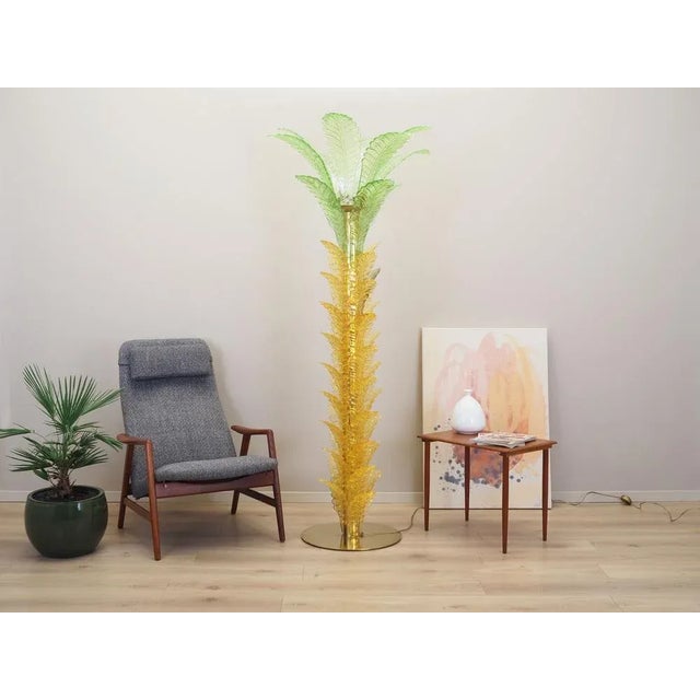 The Palma lamp was made in the 1970s, Italian production. The lamp is made of brass and Murano glass in yellow and green....