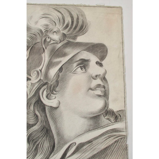 Modern pencil and charcoal sketch of a heroic male head on sketch paper. Drawn in pencil with washes of charcoal shading,...