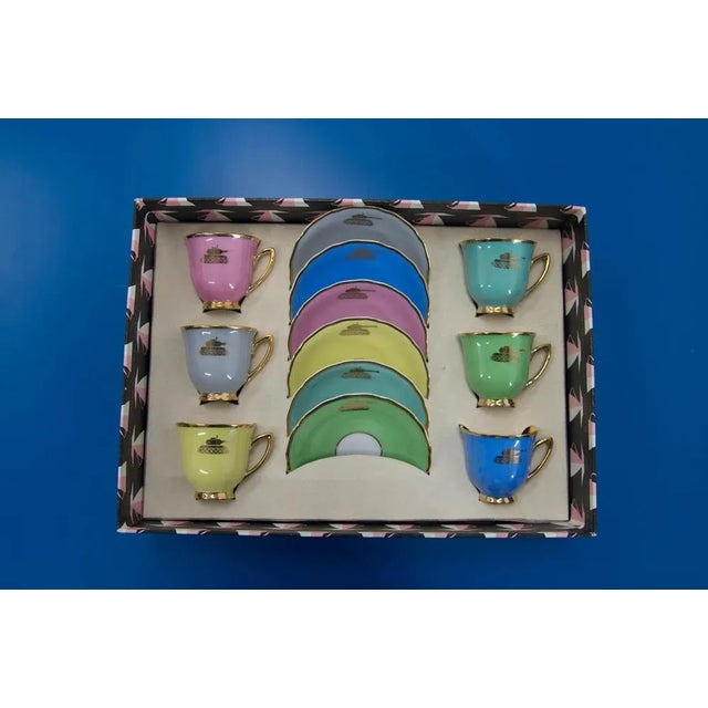 Never used set of six cups and plates. Very unusual decor - gold tanks Made in Karlsbad in Czechoslovakia in 1970s....