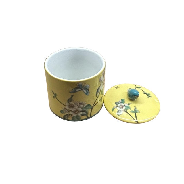 Elevate your home decor with this exquisite modern porcelain container urn. Its vibrant yellow body is adorned with...