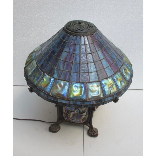 A big, beautiful lamp made after the Tiffany model, with the same great opalescent glass and a flowing bronze body with...