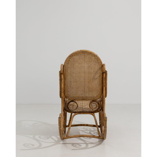 A distinctive rocking chair combining Thonet-style bentwood techniques with faux bamboo and rattan elements. Thonet...