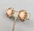 Modernist openwork faux-coral cabochon clip and screw back earrings. Marked "Napier." Date to 1973. Measure: 1 inch long...