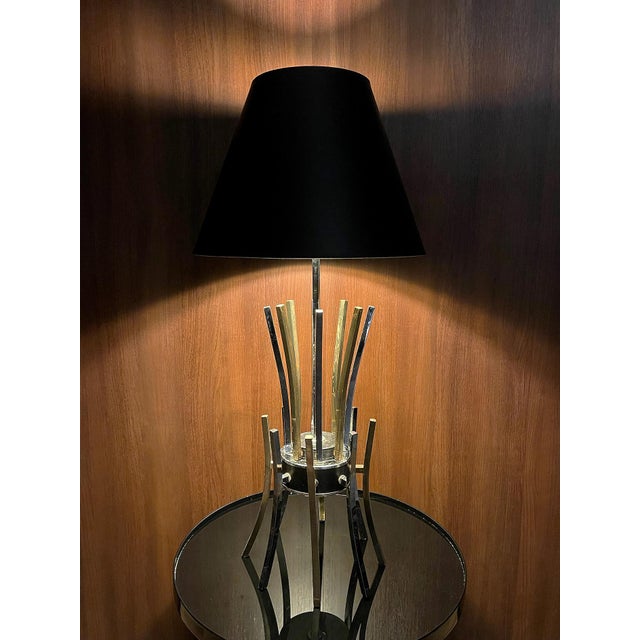 A striking 1970s Space Age sculptural table lamp, distinguished by an extraordinary architectural arrangement of polished...