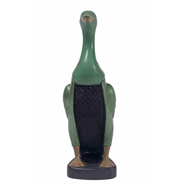Duck-Shaped Bakelite Clothes Brush with Holder, Mid-20th Century. Charming novelty clothes brush crafted in the form of a...