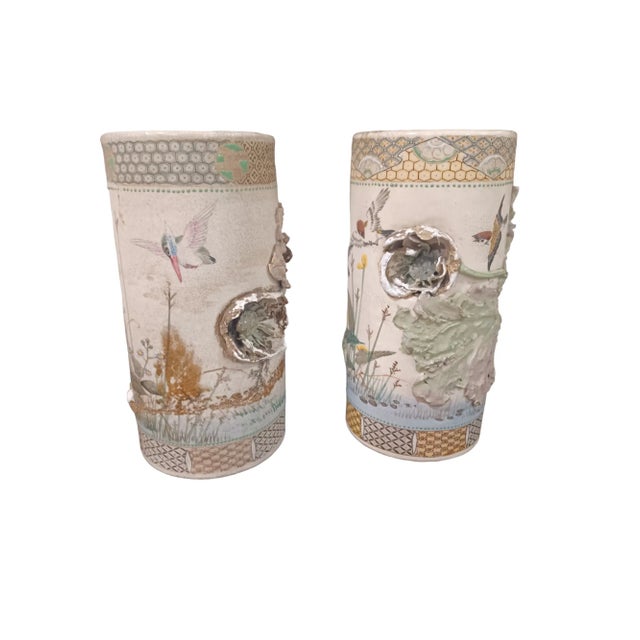 Antique pair of Makuzu Kozsn Style applique earthenware cache pots depicting lowers and birds. Some losses to the applique...