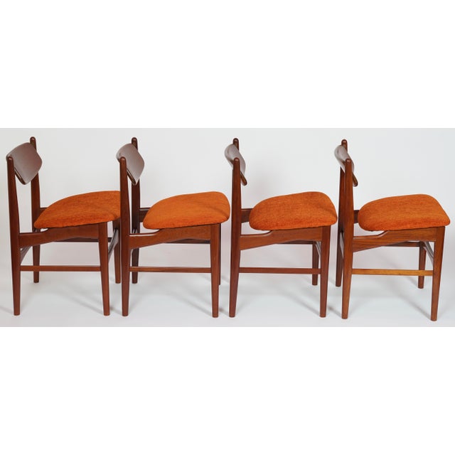 Super unique Danish modern design by Arne Hovmand Olsen from the 1950's. The backs of these chairs are hinged to contour...