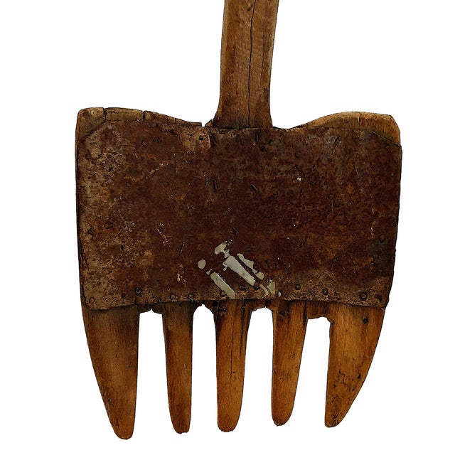 This tool stands as a silent testament to decades upon decades of back-breaking labor and thrift. Handcrafted, and likely...