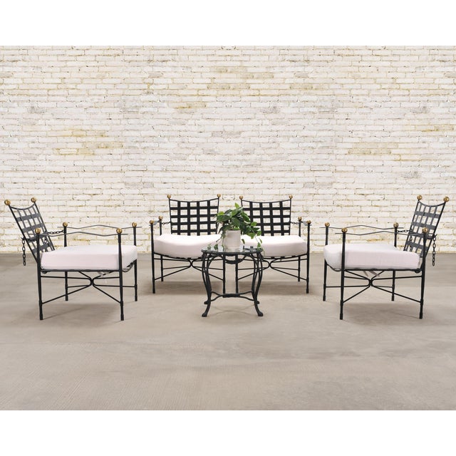 An iconic and rare set of four of "Amalfi" lounge chairs with adjustable chain backs after the mid-century modern design...