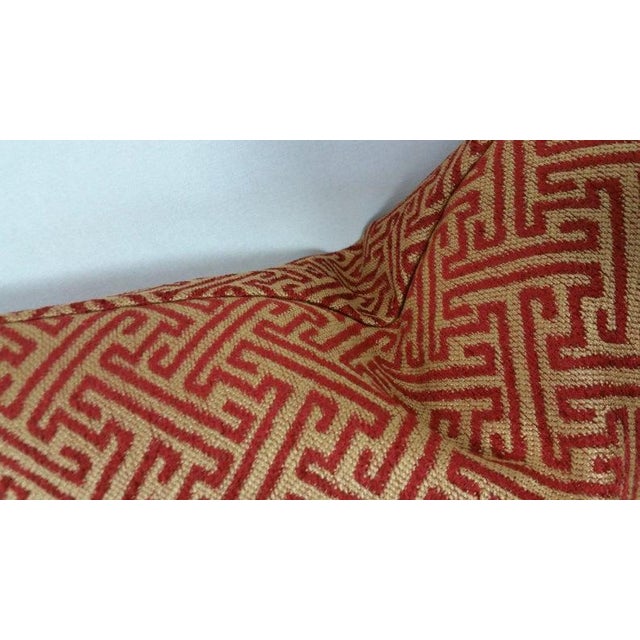 From Kravet Smart is a red and gold fretwork pattern lumbar pillow cover. The gold catches the light and brings out a...