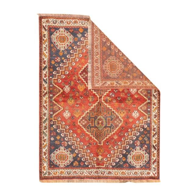 Fine vintage hand-knotted Persian Qashqai rug with stepped geometric medallions arranged along the central field. Stylized...