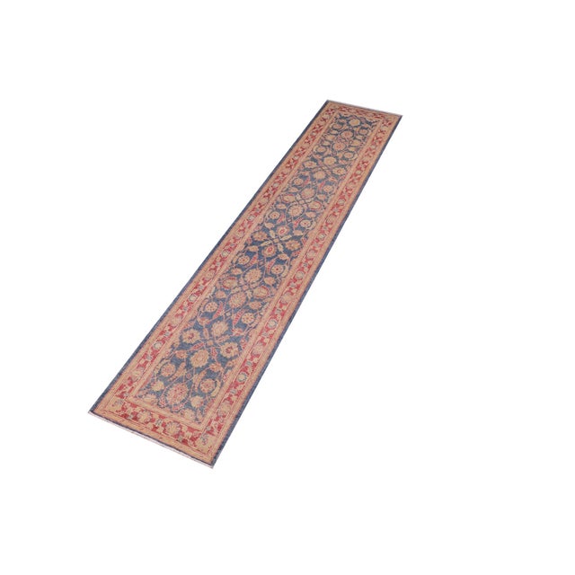 Enhance the ambiance of your home with this magnificent Persian-influenced Turkish hand-knotted rug made by skilled...