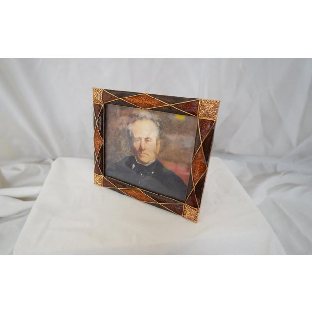 Crystal & Enamel Rust Colored Jay Strongwater Frame Frame opening 4.5" w x 3.5" h In each of the four corners are small...