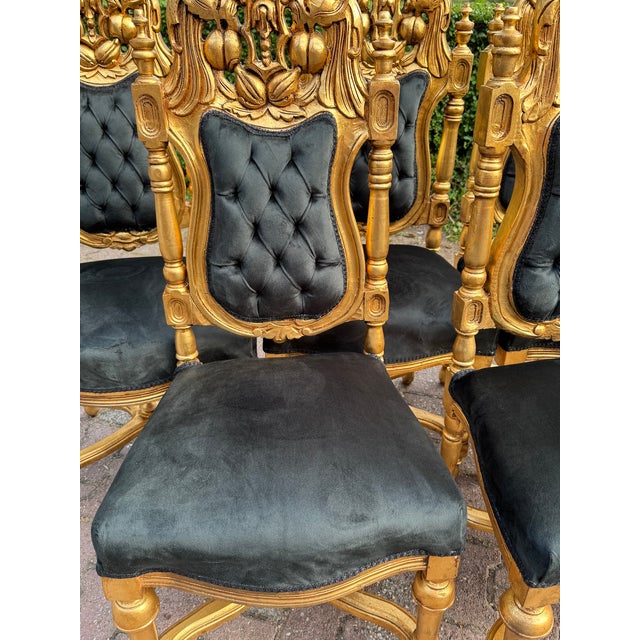 An extraordinary set of eight Italian Rococo Revival chairs, handcrafted circa 1900 and richly detailed with sculptural...