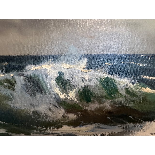 This expressive vintage oil painting depicts a dramatic coastal seascape with powerful rolling waves crashing against...