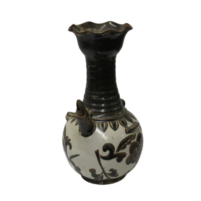 This is a handmade Chinese accent decorative art made of ceramic in brown black mix color. This piece has a wave pattern...