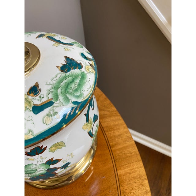 Beautiful Green Floral Lamp with Brass and gold accents. Brass Finial Purchased at the Waterford Wedgewood store in the...