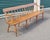Circa 1840-1860 American antique deacons bench made of pine and elm. Features spindle back spindle legs rolled arms and...