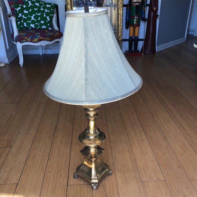 Cozy up to this solid brass lamp with pagoda features and footed Details. In good working Vintage Condition. Lampshade...