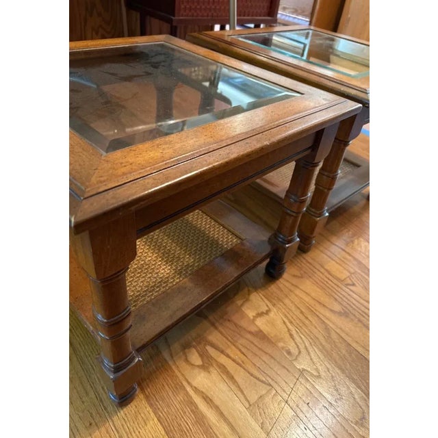 Vintage 1970s square accent table pair. Solid wood with caned bottom shelves and beveled glass tops. Super cute diminutive...