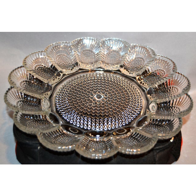 1950s Indiana Glass Company vintage glass egg plate with hobnail design, in transparent glass, about 11 inches diameter...