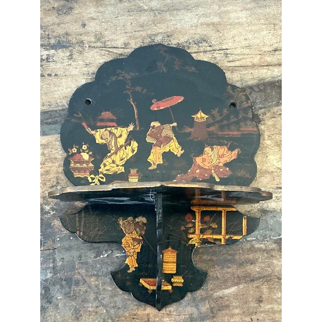 This exquisite vintage folding wall bracket is a stunning example of Chinoiserie artistry, perfectly capturing the...