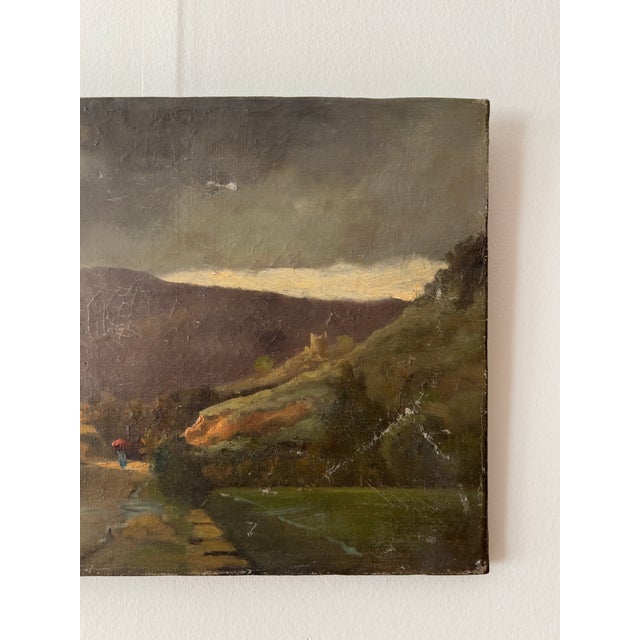 A 19th Century landscape painting on canvas from France depicting a figure on path. Apparenty unsigned. Unframed.