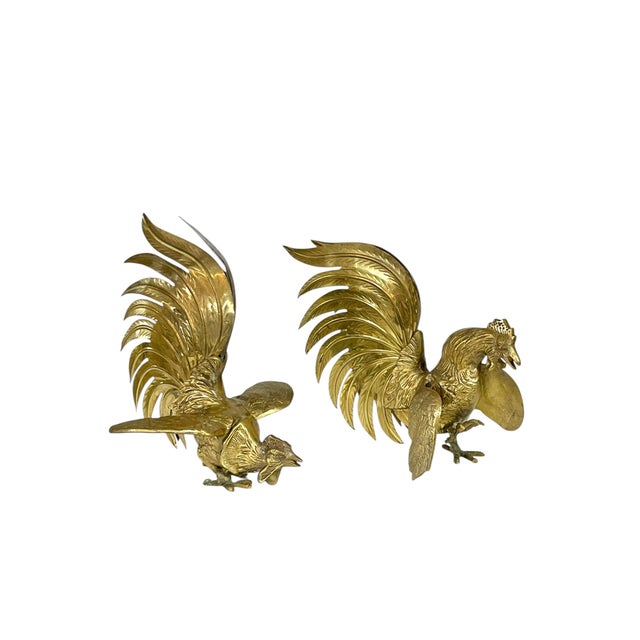 Pair of mid twentieth century brass roosters. Roosters are slightly different. Lots of detailing on the faces. The...