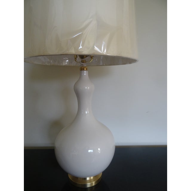 A Chic Christopher Spitzmiller lamp still with original tag original wrapping and original box. With Ivory parchment shade...