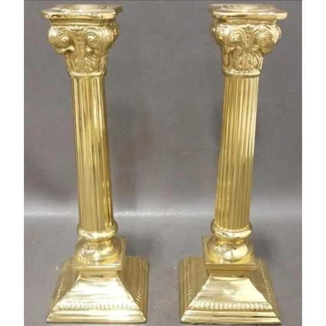 A stunning pair of ornate vintage candle holders. The Neoclassical candle holders are imported, hand-crafted and crowned...