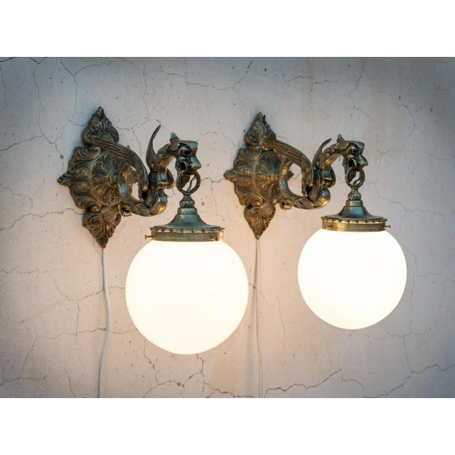 Spectacular 1950s Spanish Gothic Revival Brass Dragon Wall Sconces with White Opaline Glass Globes - An Exclusive One-of-...