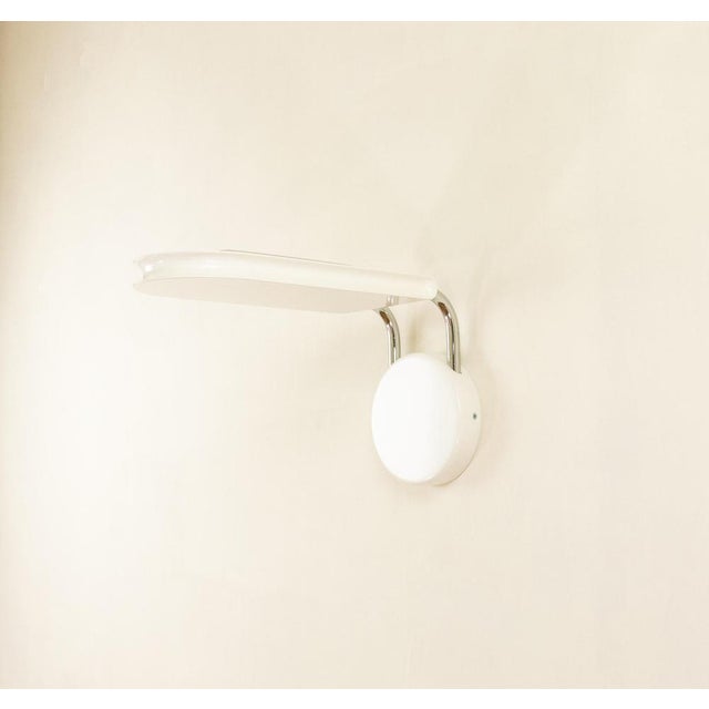 Gesto halogen wall lamp by Bruno Gecchelin for Skipper. After the successful Mezzaluna series Bruno Gecchelin created...