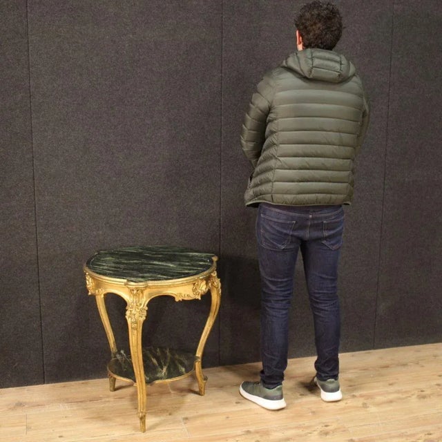 Italian living room low table from the 20th century. Furniture in carved, lacquered and gilded wood with beautiful lines...