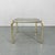 Vintage side table with brass finish and original smoked glass top. Good vintage condition.