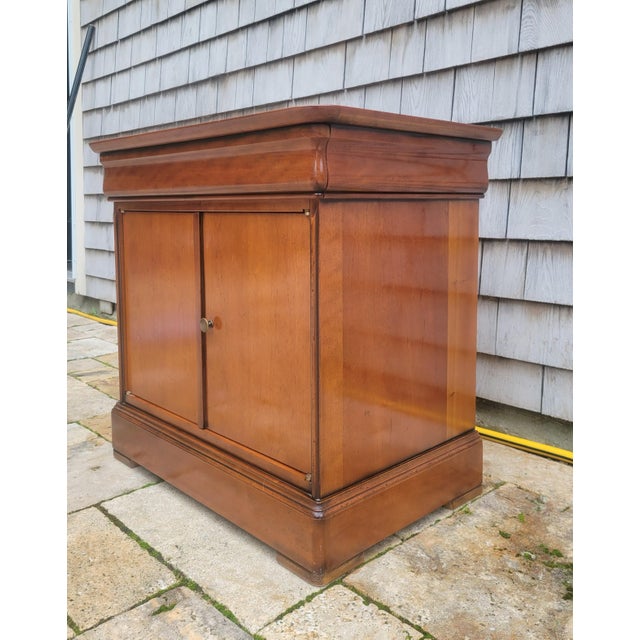An exquisite benchmark French cabinet crafted by legendary furniture maker Grange, beautifully constructed from premium...